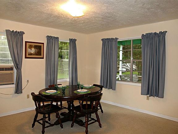 You can see the lake from the dining room or head on out to the covered porch and sit in the swing.... You're gonna love it!
