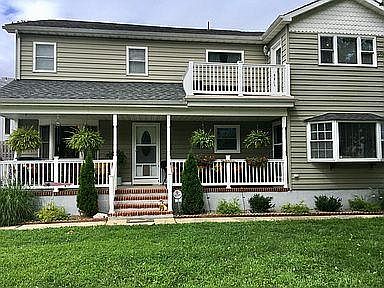 Apartment for lease is door at top of porch steps. First floor, left side looking at house.
