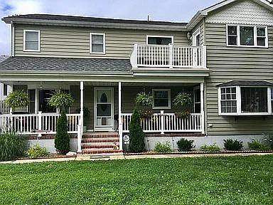 Apartment for lease is door at top of porch steps. First floor, left side looking at house.