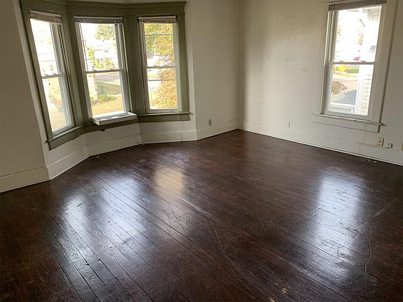 Living Room with Bay Windows overlooking Fifth St.