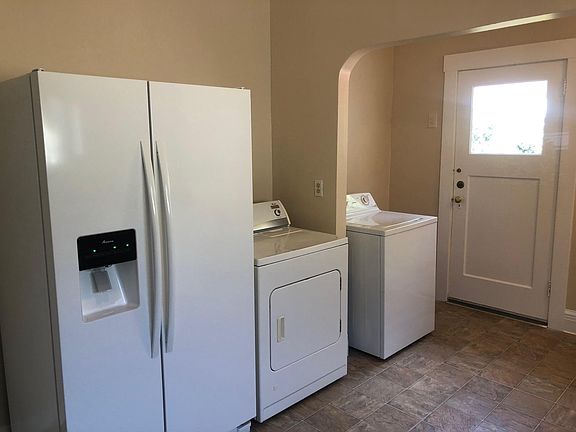 Refrigerator, washer and dryer included.