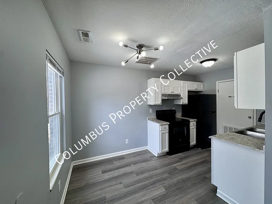 Newly updated 2-bedroom, 1.5-bathroom two-story townhome with a private entrance in Eastmoor perf... — Photo 3