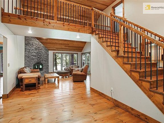 Impressive entry to a formal dining room to the left. Beautiful pine floors flow through the main level.