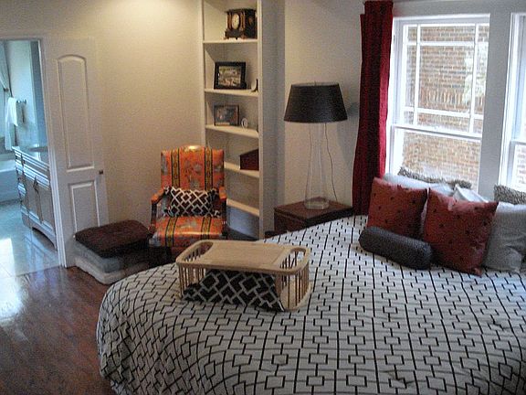 Master with separate sitting area and built in book shelves. 