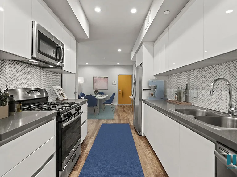 Full-Size Kitchen with Stainless-Steel Refrigerator, Stove, Microwave Oven, and Dishwasher