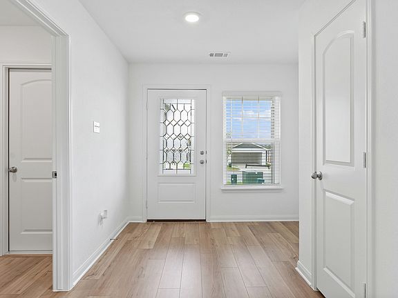 The beautiful entry leads to the family room!