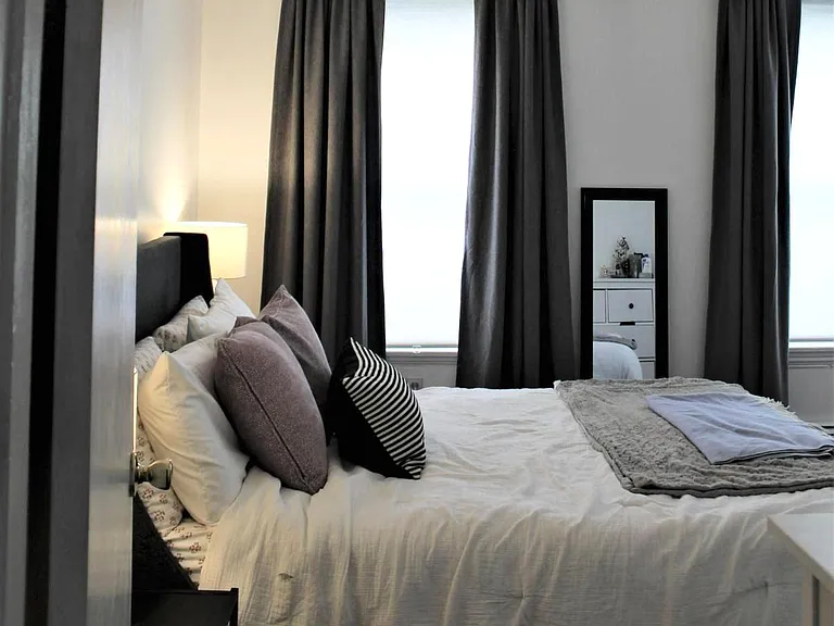 Large 2nd floor bedroom facing street