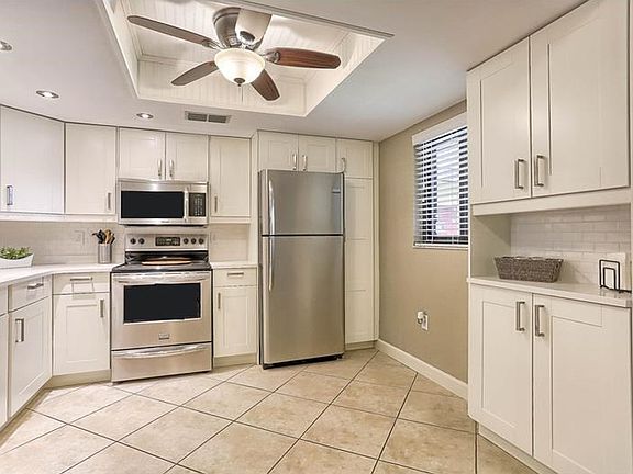 Tastefully updated kitchen with new cabinets, quartz counted top, stainless steel appliances, new ce