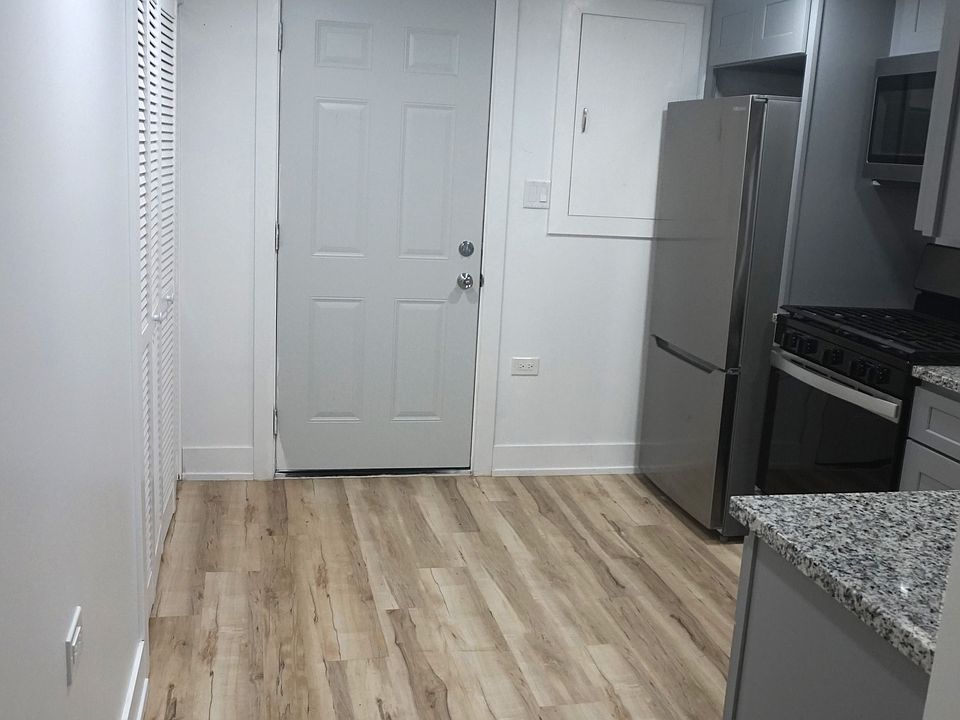 Newly remodeled kitchen with back entrance door. Room for a small table