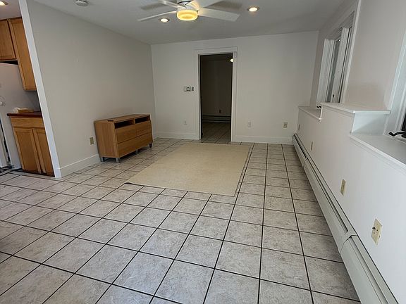 Dining/Living Area. Windows face the private woods behind the house.