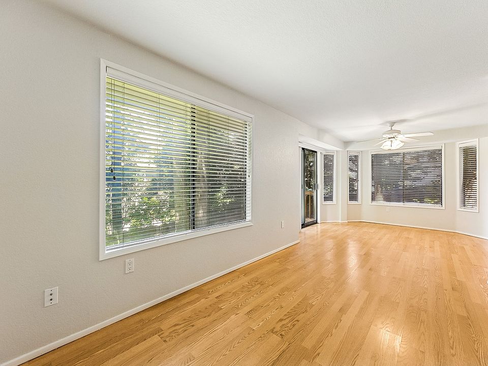 Wall of windows and sliding glass door brings in natural light
