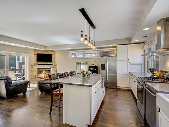 Living space with fireplace and access to outdoor deck