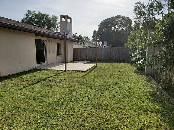 Fenced back yard with patio