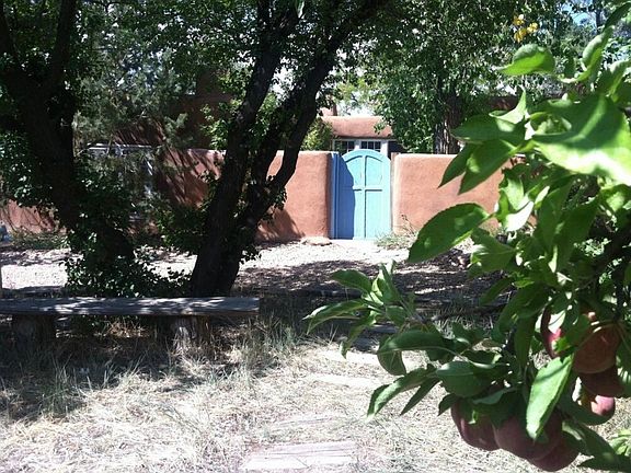 Enter front courtyard through blue gate and go straight into entry foyer.