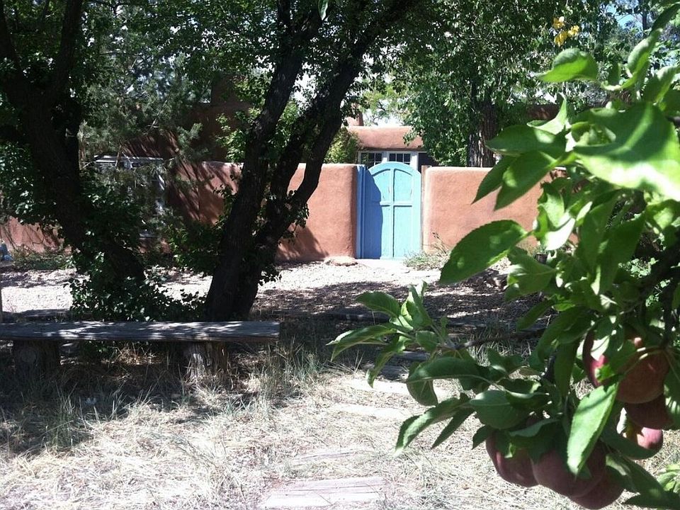 Enter front courtyard through blue gate and go straight into entry foyer.