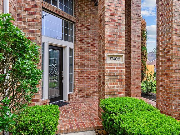 Attractive front entrance with unique BIRD CAGE LIGHT overtop of entrance (unseen in photo).