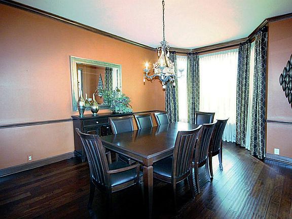 Immediately to your right, you will find the formal dinging room with hardwood floors and crown molding.