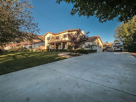 FOUR car garage & RV access.