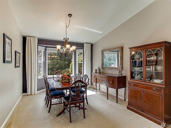 Spacious formal dining room offers a lovely bay window and serene views.