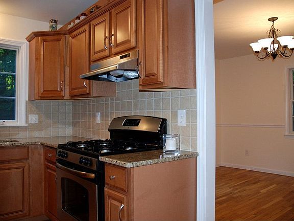 Kitchen leads to Formal DR w/chair rails