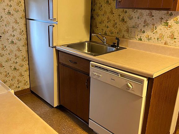 Kitchen view - fridge and dishwasher