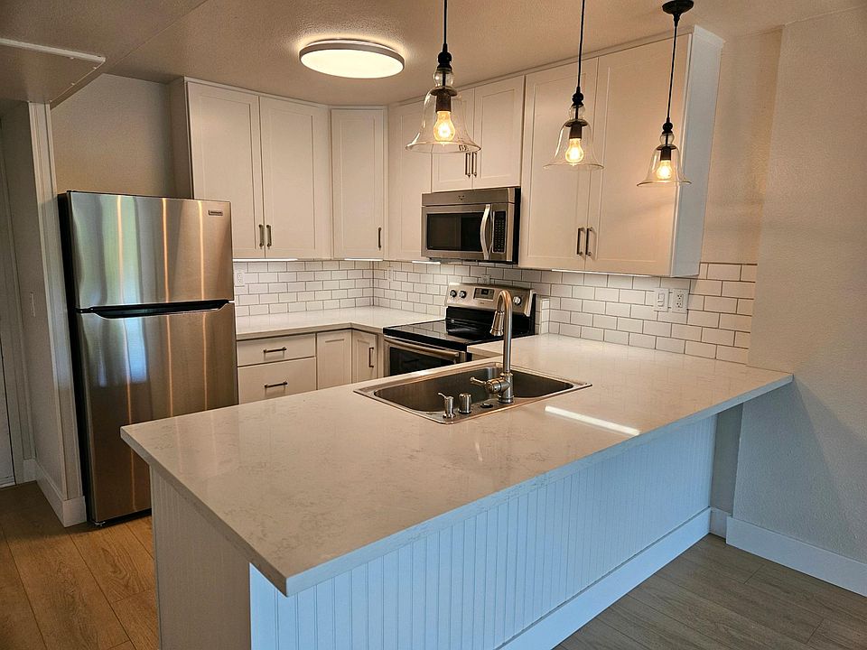 New kitchen, stainless appliances and sink, quarts wrap-around counters, breakfast bar