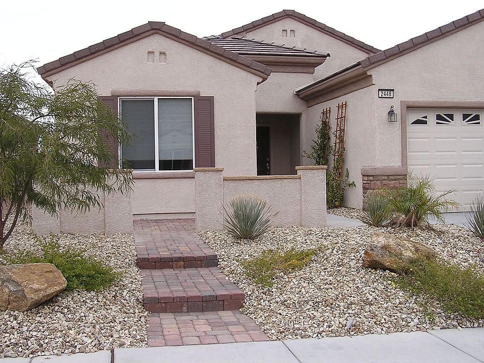 Front w/cobblestone entry & patio