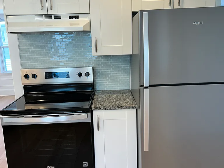 Modern bright large kitchen with brand new appliances