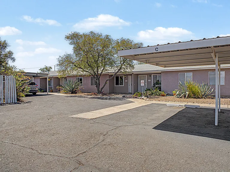 Entrance view with covered parking in Space C.
