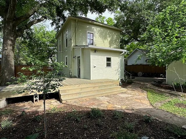 A view of the back of the house and deck, from the garden.