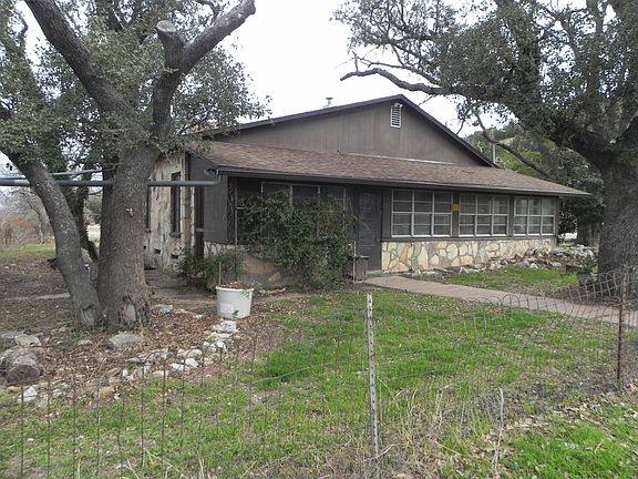 Back of house with enclosed porch