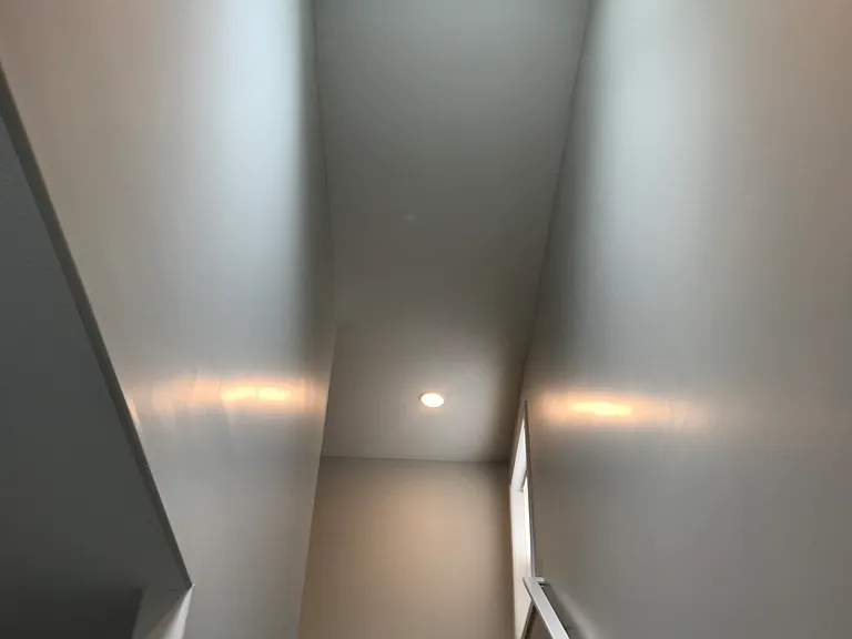 Stairs to 2nd floor also showing a skylight which lights it up nicely