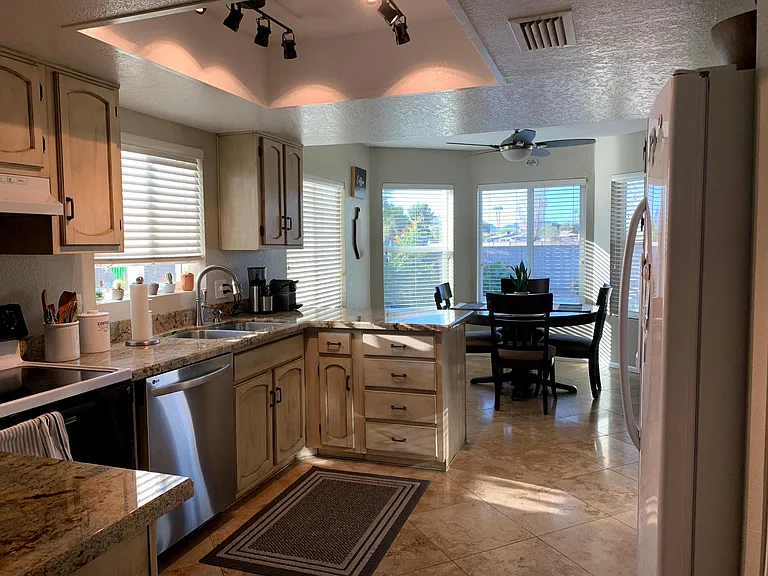 Kitchen with dining area in background