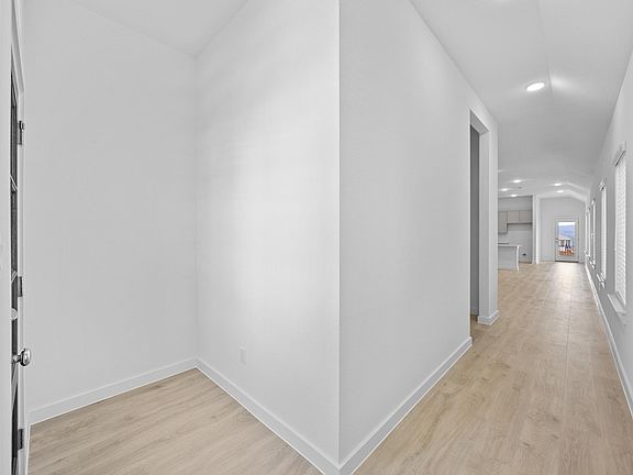 Hallway in the Pecan II home plan by Trophy Signature Homes - REPRESENTATIVE PHOTO