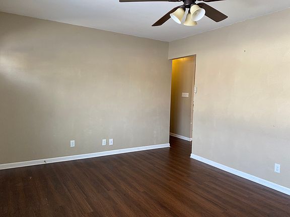 Living room, door to hallway and kitchen
