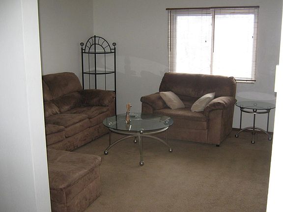 Spacious living room with large south facing window.