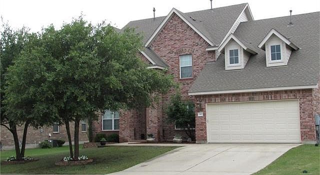 Your new home sweet home! The oaks are maturing with decorative stone flower beds. Retaining wall with lovely bushes. Lava stone surrounding clay pots and a beautiful lilac tree.