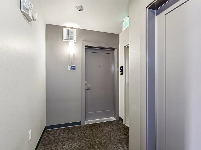 Navigate the modern and convenient common areas at 4400 Alaska, a prime apartment community in Seattle, WA. This hallway features stylish decor and easy acce...