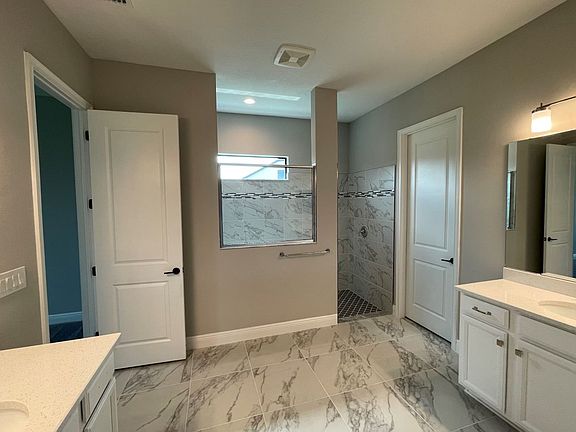 Sweet bay new construction quick move-in home plan owner s bathroom at Cross Creek by William Ryan H