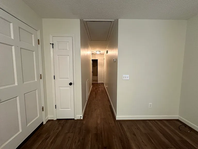 hallway from living room to the 3 bedrooms and 2 baths