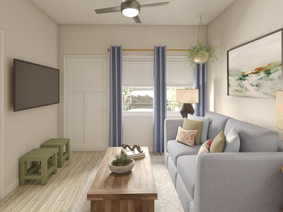 Greenwood Commons living area showing the front door and window to the balcony/patio.