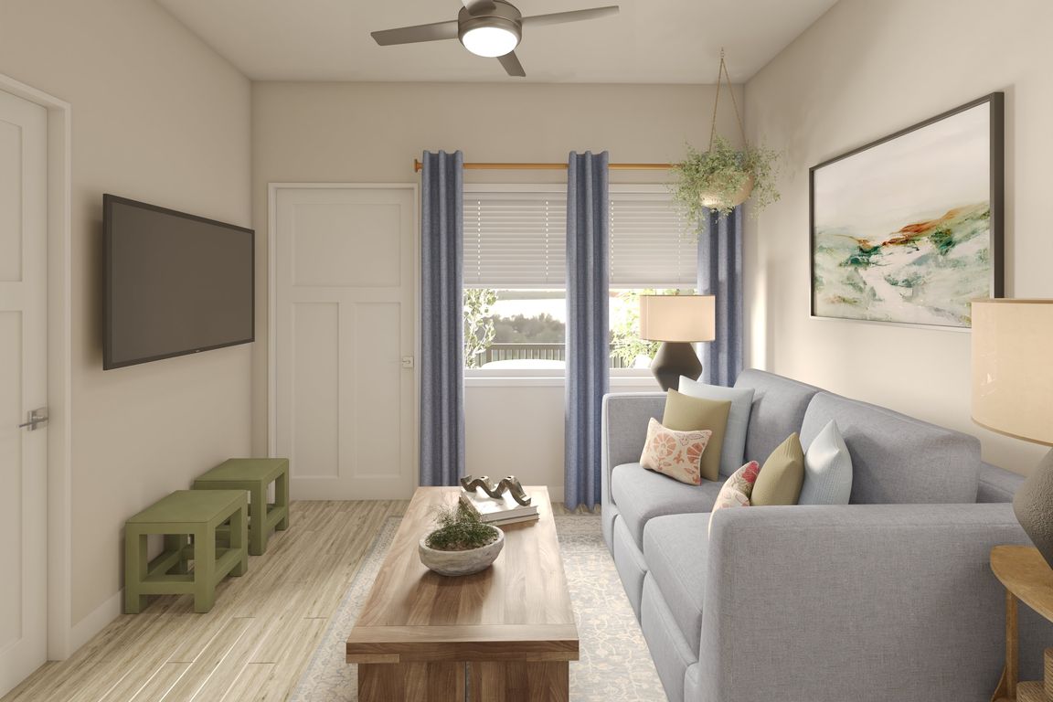 Greenwood Commons living area showing the front door and window to the balcony/patio.