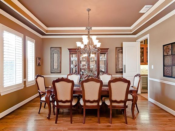The formal dining room is located on the left of the home with large plantation shuttered windows overlooking the front yard.
