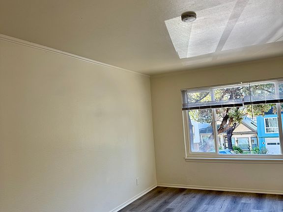 Huge Living Room with view of Monterey Blvd through Double Pane windows for quiet enjoyment