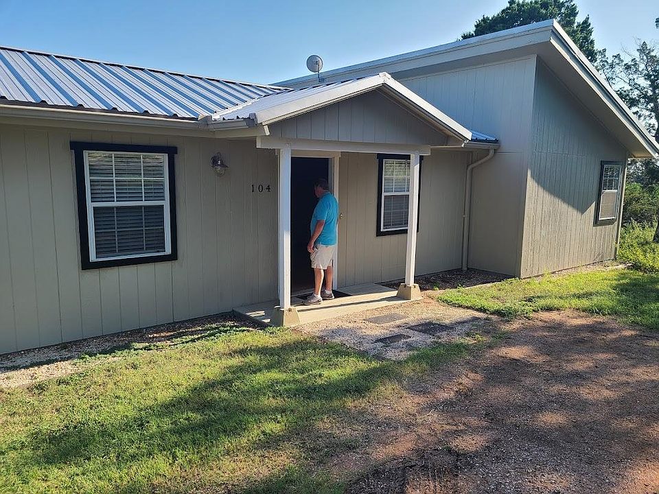 Well kept home with metal roof in an established neighborhood.