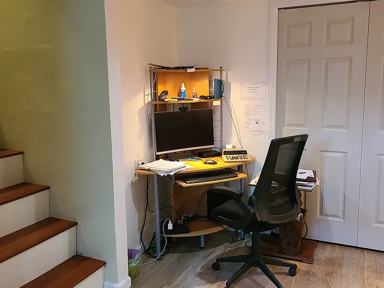 Finished living area in the basement could serve as a home office