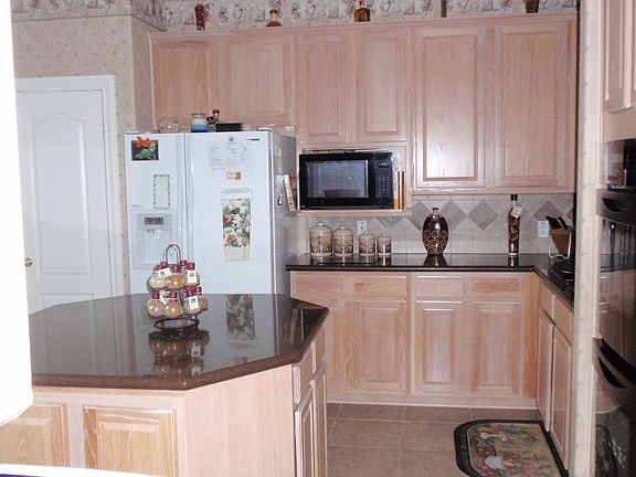 Kitchen with large island and granite counters