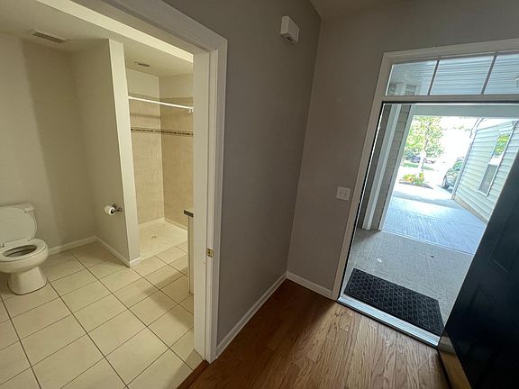 Full guest bathroom attached to the entrance lobby