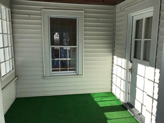 Front entry porch area. Three-season area for sitting, mud r