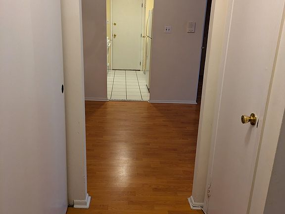 View from bathroom landing into dining room and kitchen